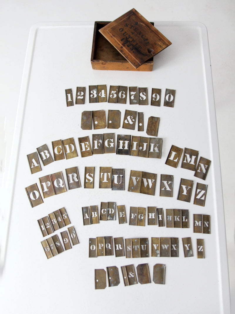 1920s brass stencil set with box