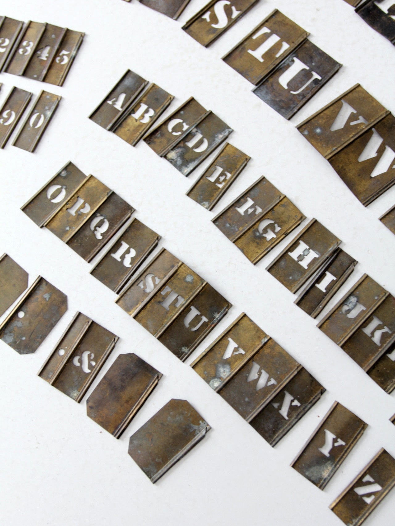 1920s brass stencil set with box