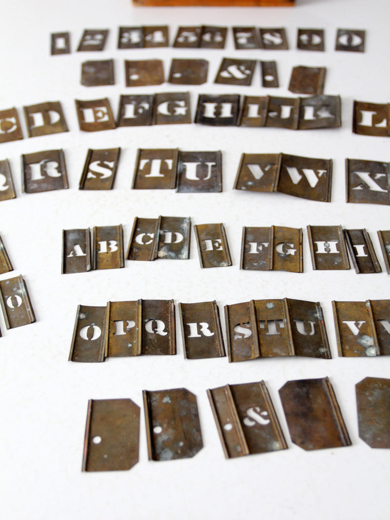 1920s brass stencil set with box