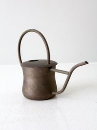 vintage brass watering can