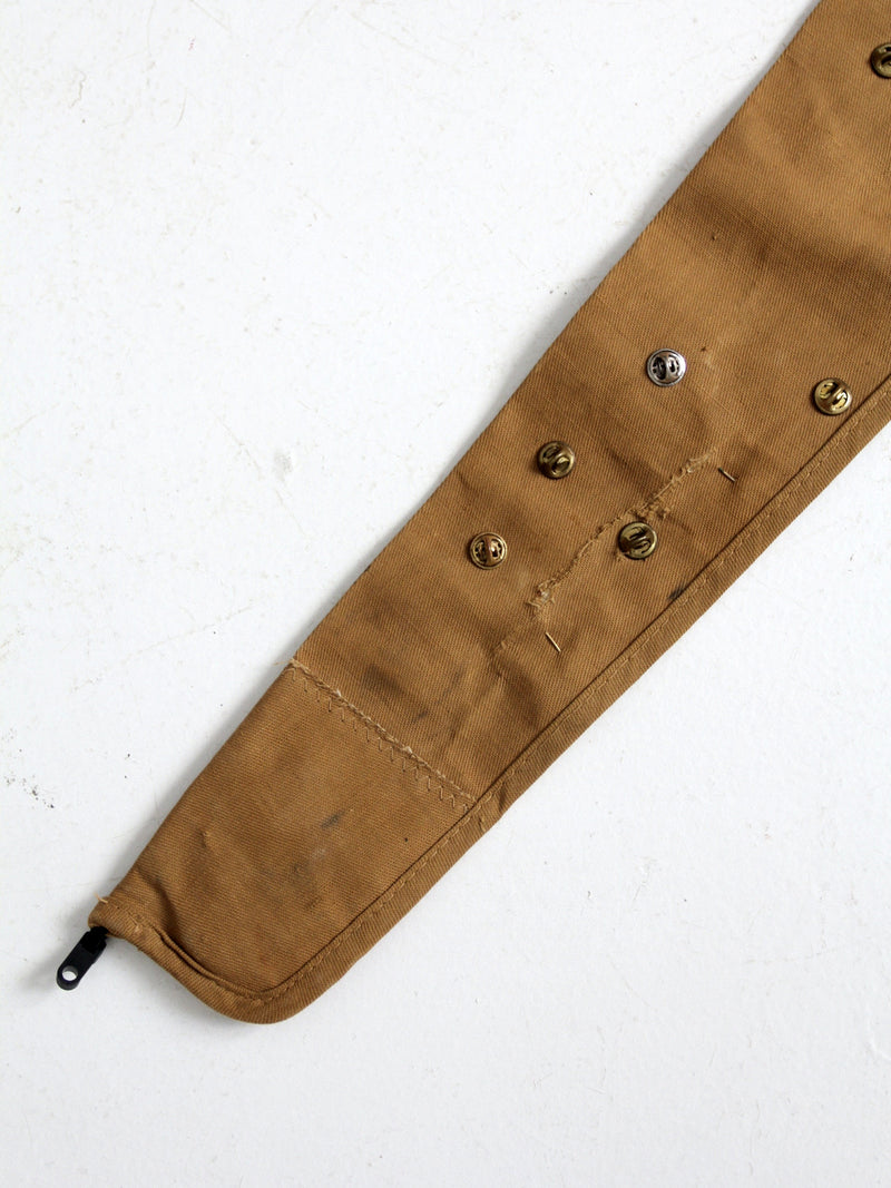 vintage gun club pin collection on Blue Bill canvas rifle case