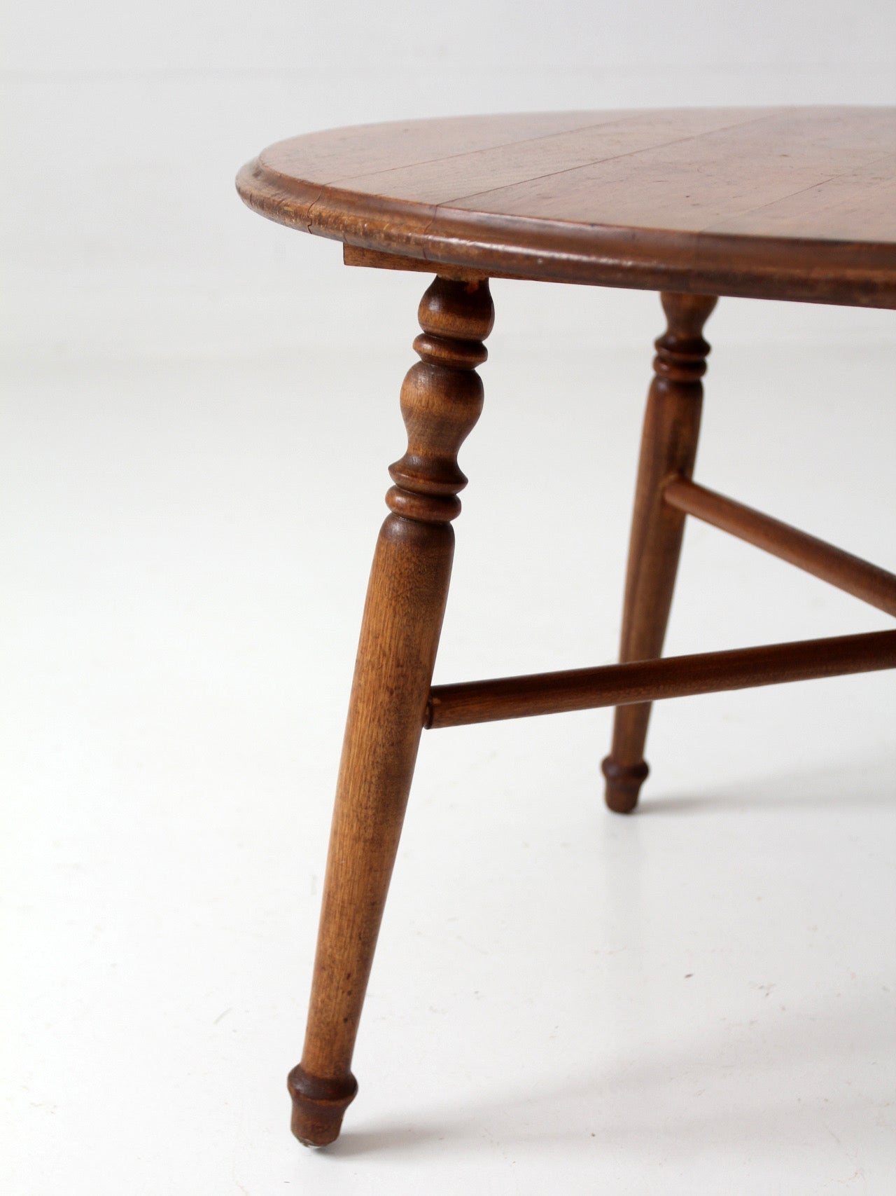 vintage round wood coffee table with turned legs