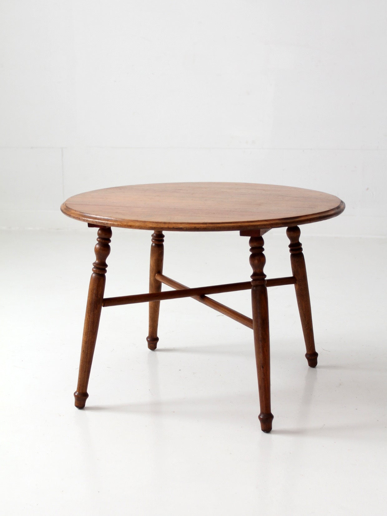 vintage round wood coffee table with turned legs