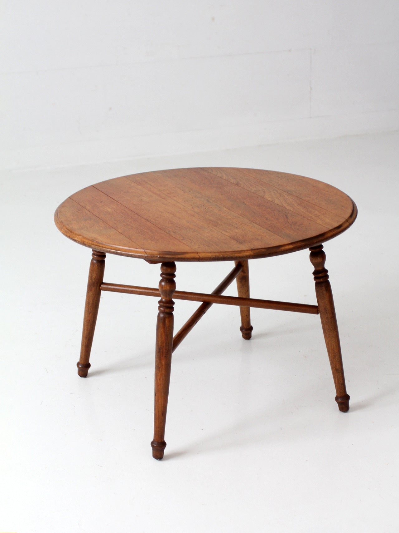 vintage round wood coffee table with turned legs