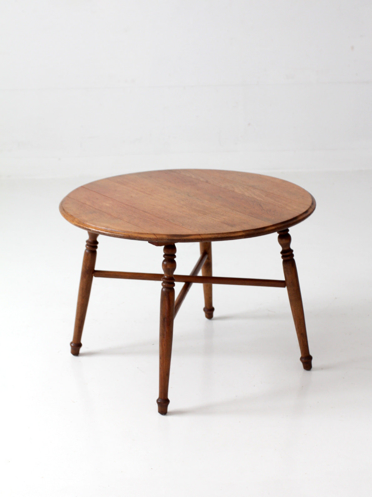vintage round wood coffee table with turned legs