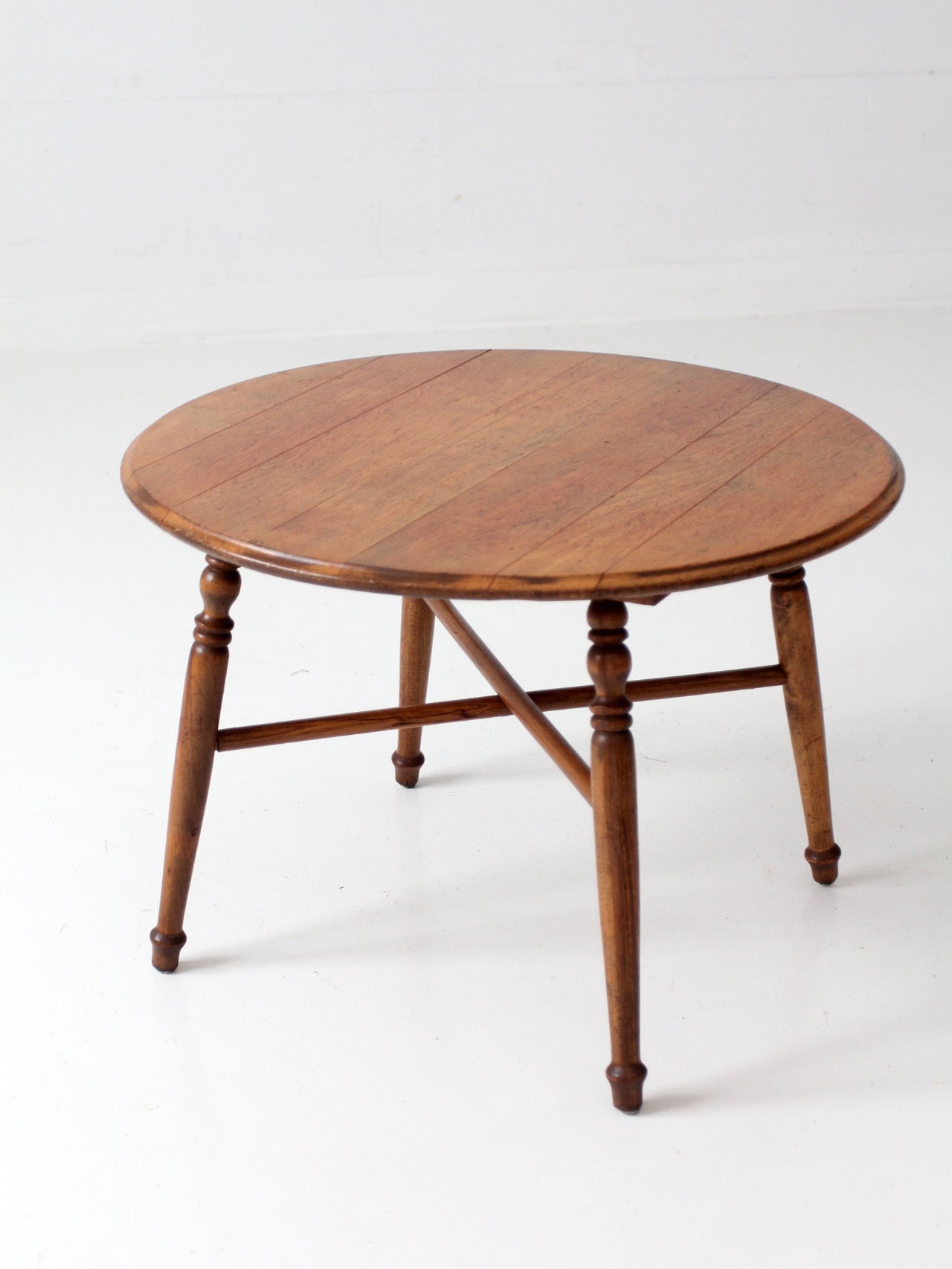 vintage round wood coffee table with turned legs