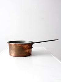 antique copper saucepan with iron handle