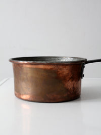 antique copper saucepan with iron handle