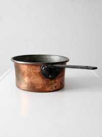 antique copper saucepan with iron handle