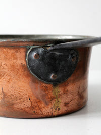 antique copper saucepan with iron handle