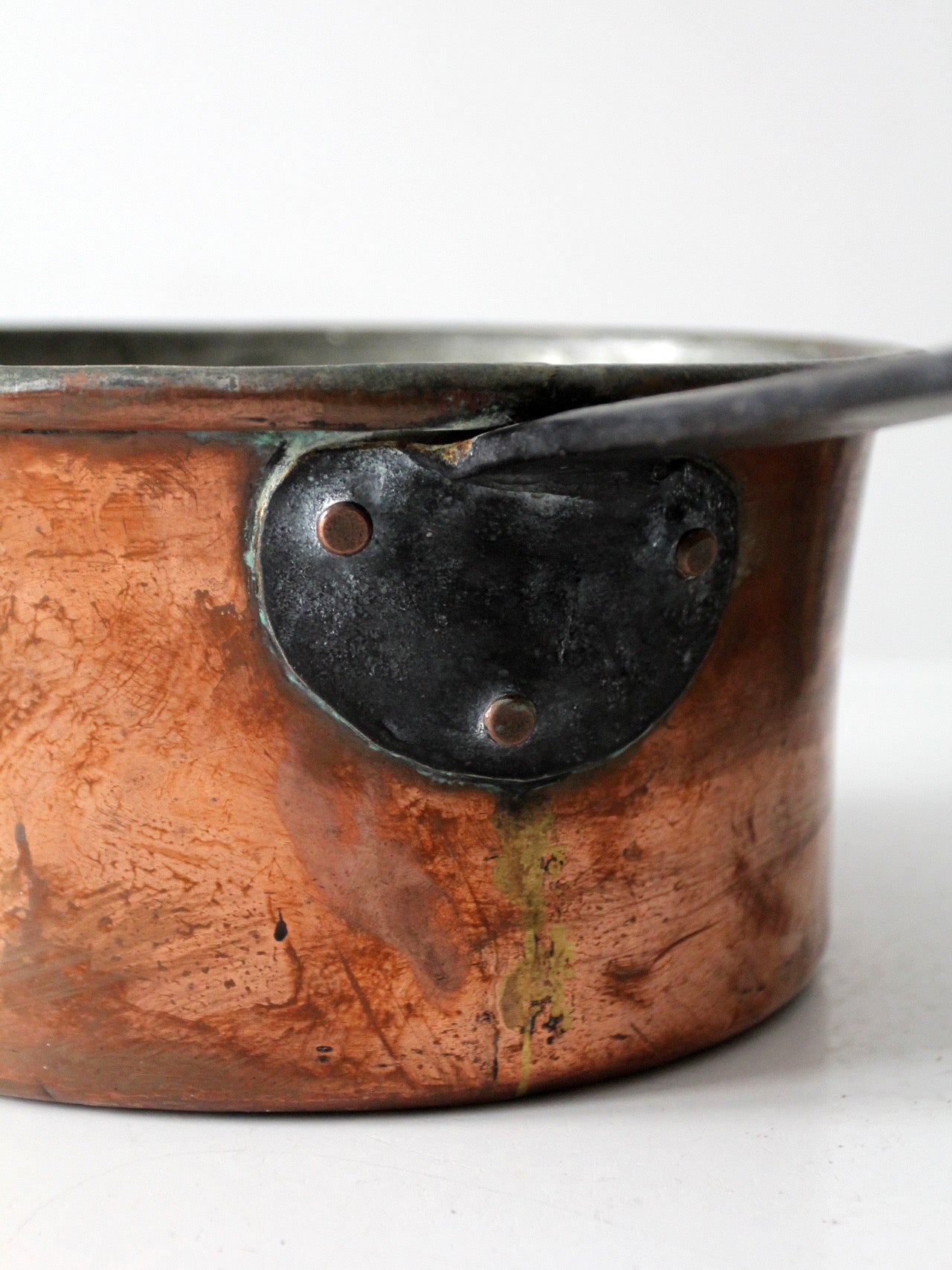 antique copper saucepan with iron handle