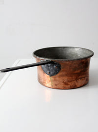 antique copper saucepan with iron handle