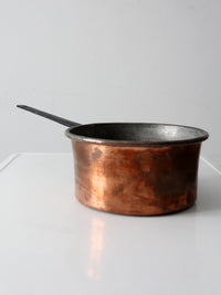 antique copper saucepan with iron handle