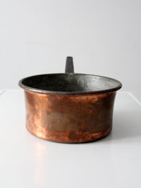 antique copper saucepan with iron handle