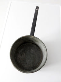 antique copper saucepan with iron handle