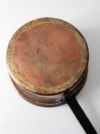 antique copper saucepan with iron handle
