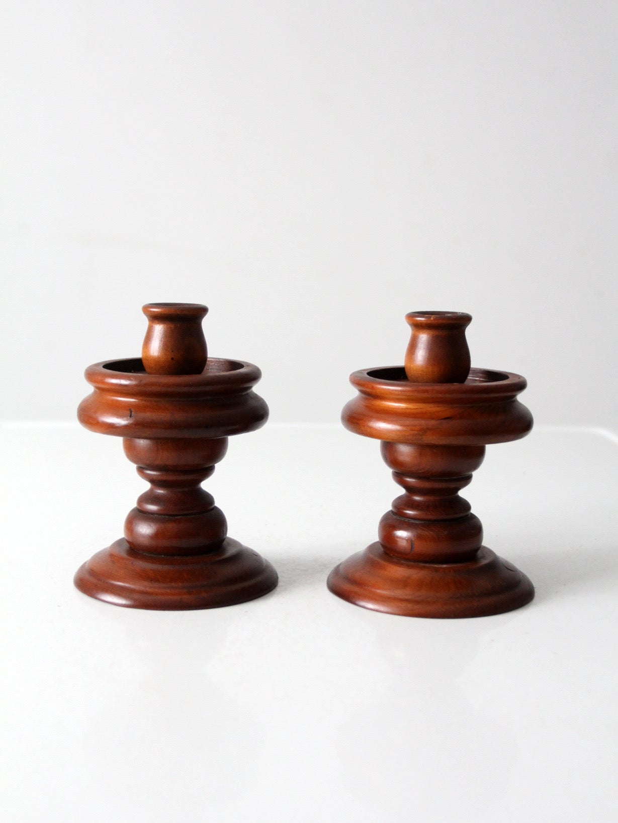 vintage turned wooden candlestick holders pair