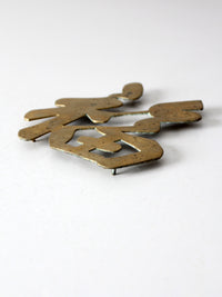 vintage brass good luck symbol trivet