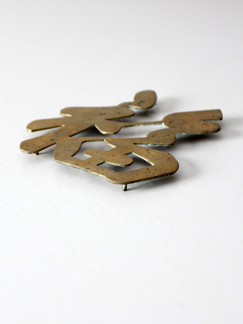 vintage brass good luck symbol trivet