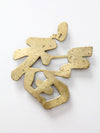 vintage brass good luck symbol trivet