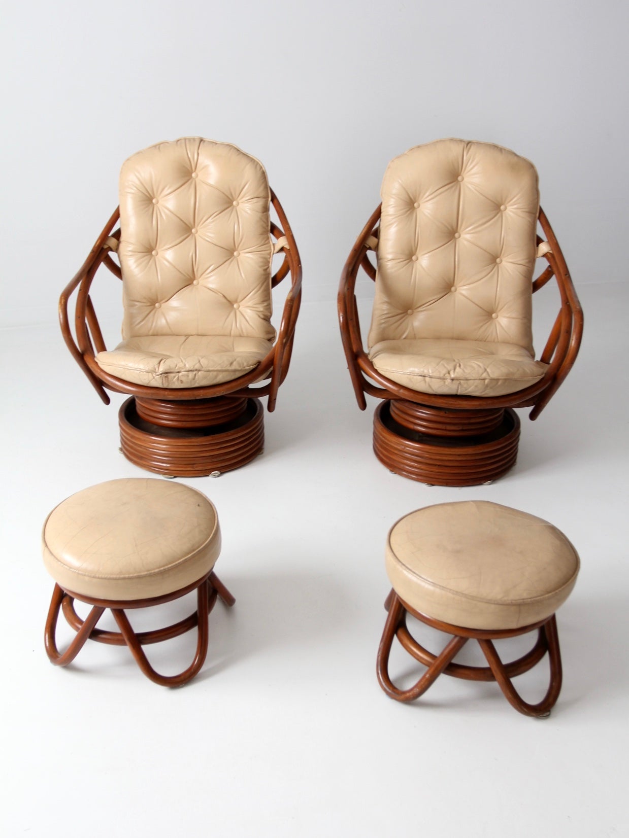 vintage 1970s rattan swivel lounge chairs with ottomans