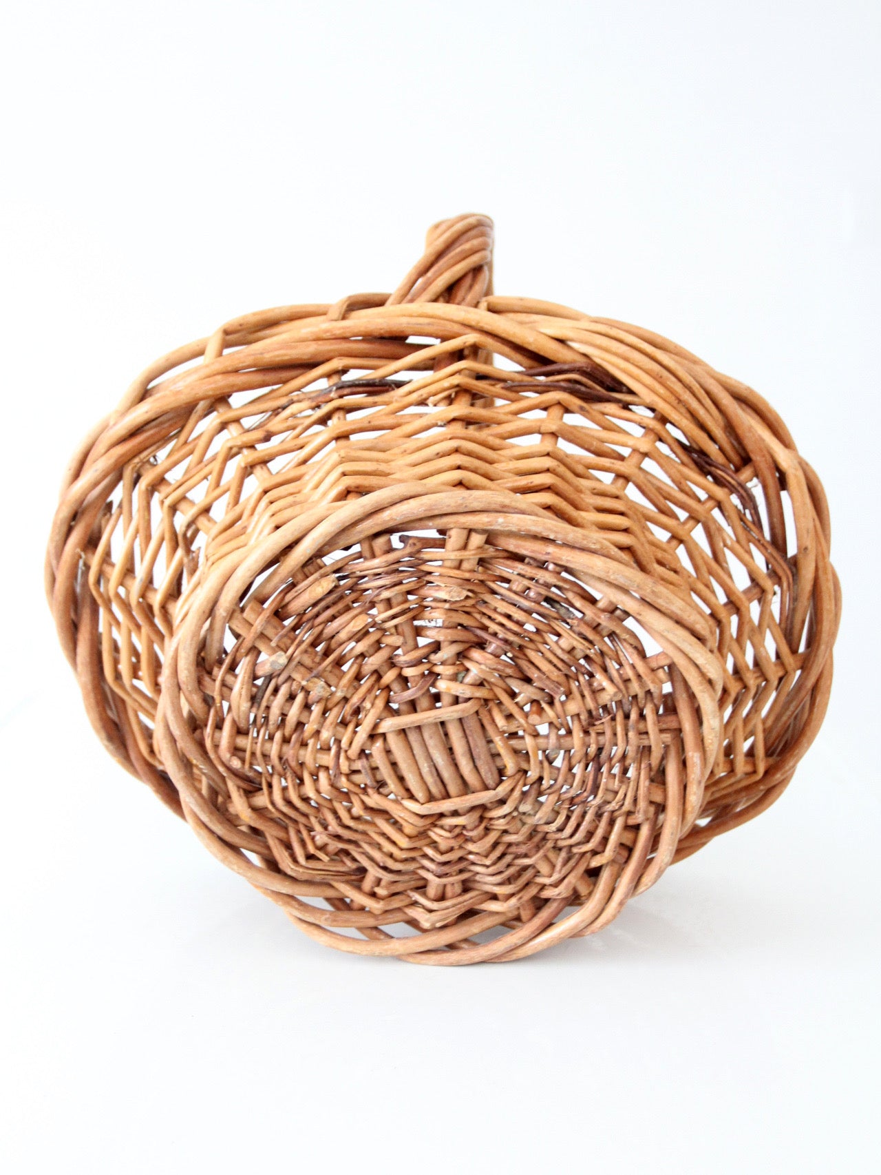 vintage woven wicker gathering basket with twisted handle