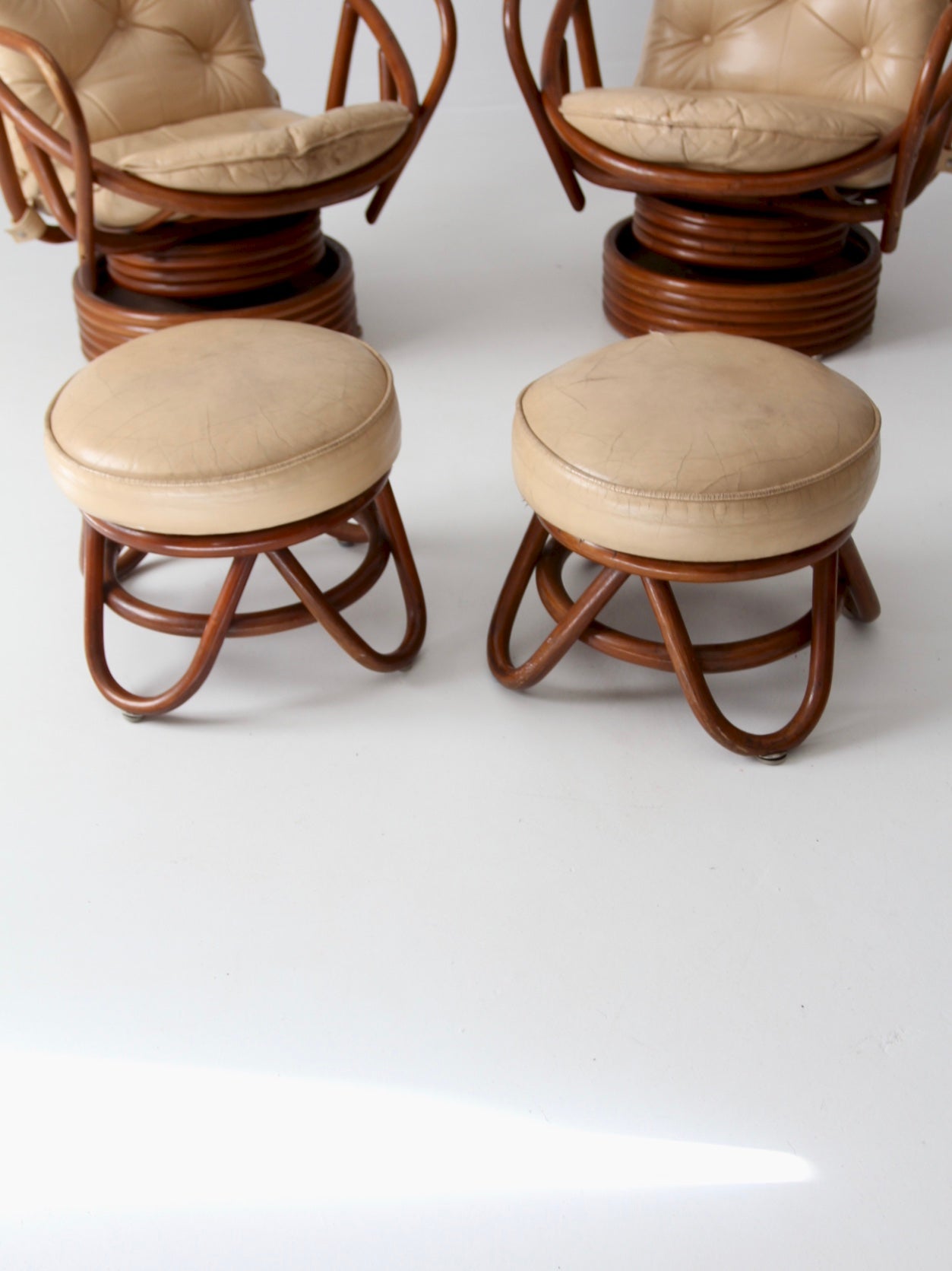 vintage 1970s rattan swivel lounge chairs with ottomans