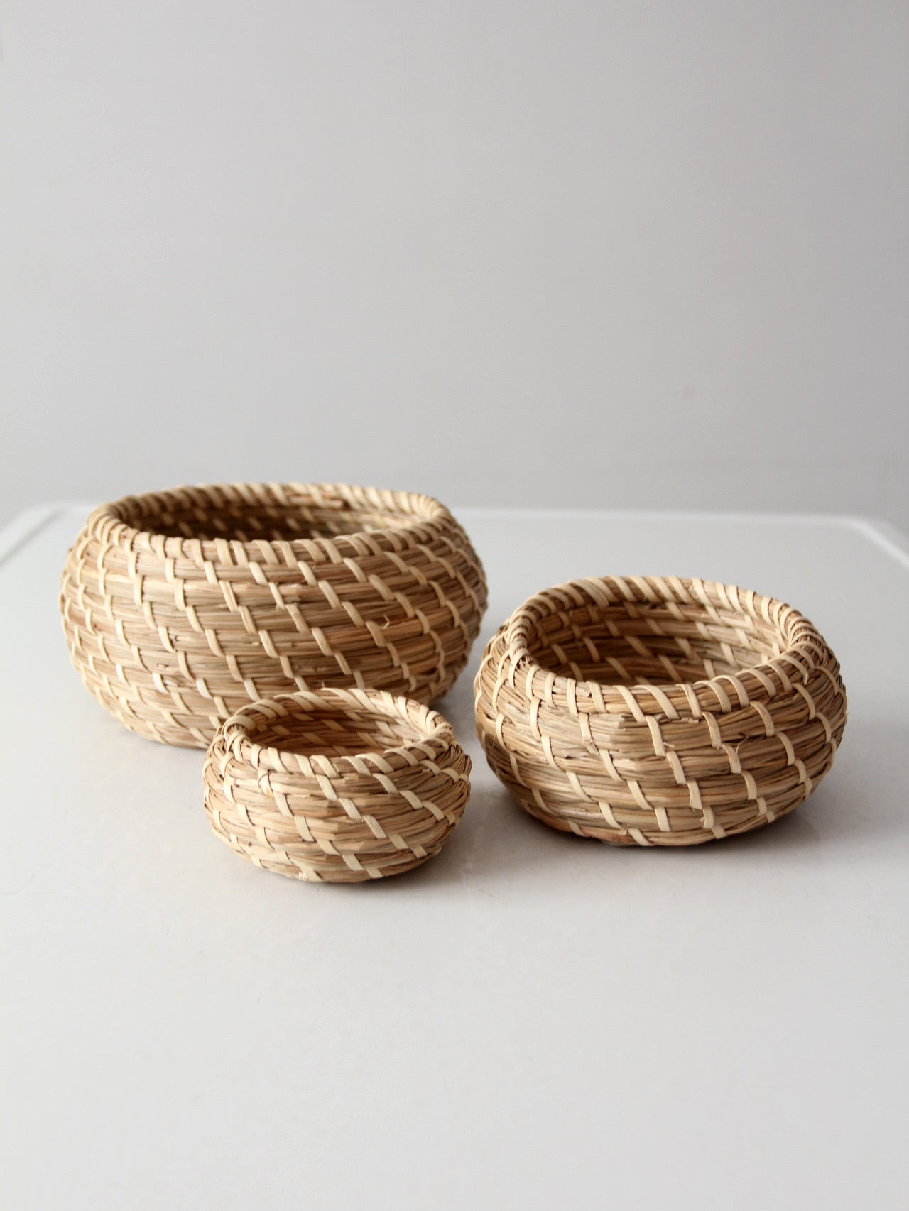 vintage set of 3 woven nesting baskets