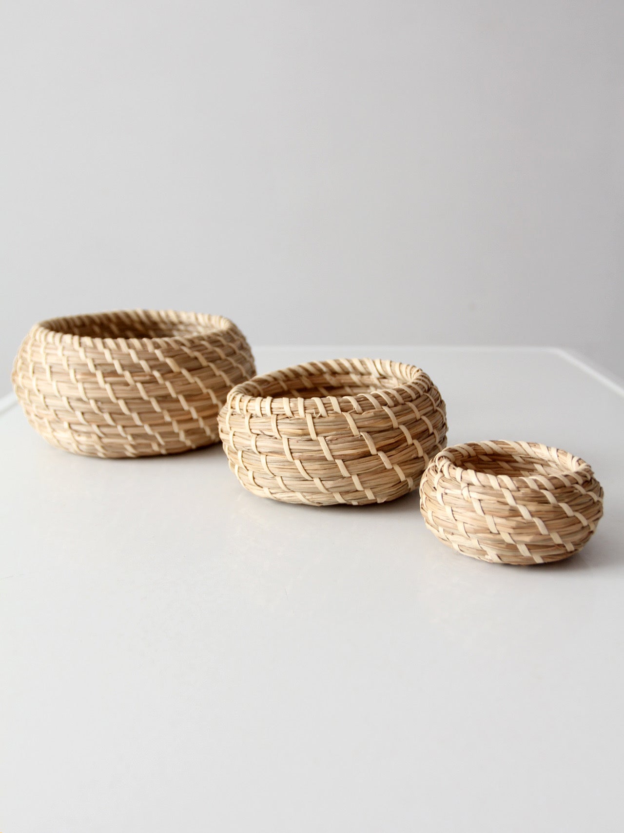 vintage set of 3 woven nesting baskets
