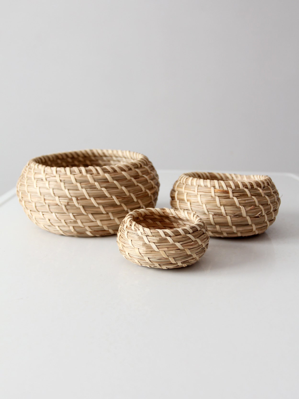 vintage set of 3 woven nesting baskets