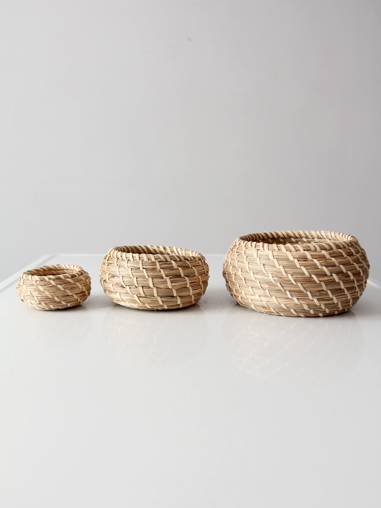 vintage set of 3 woven nesting baskets