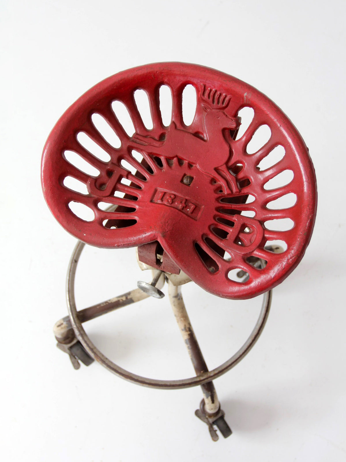 vintage industrial rolling stool with cast iron tractor seat