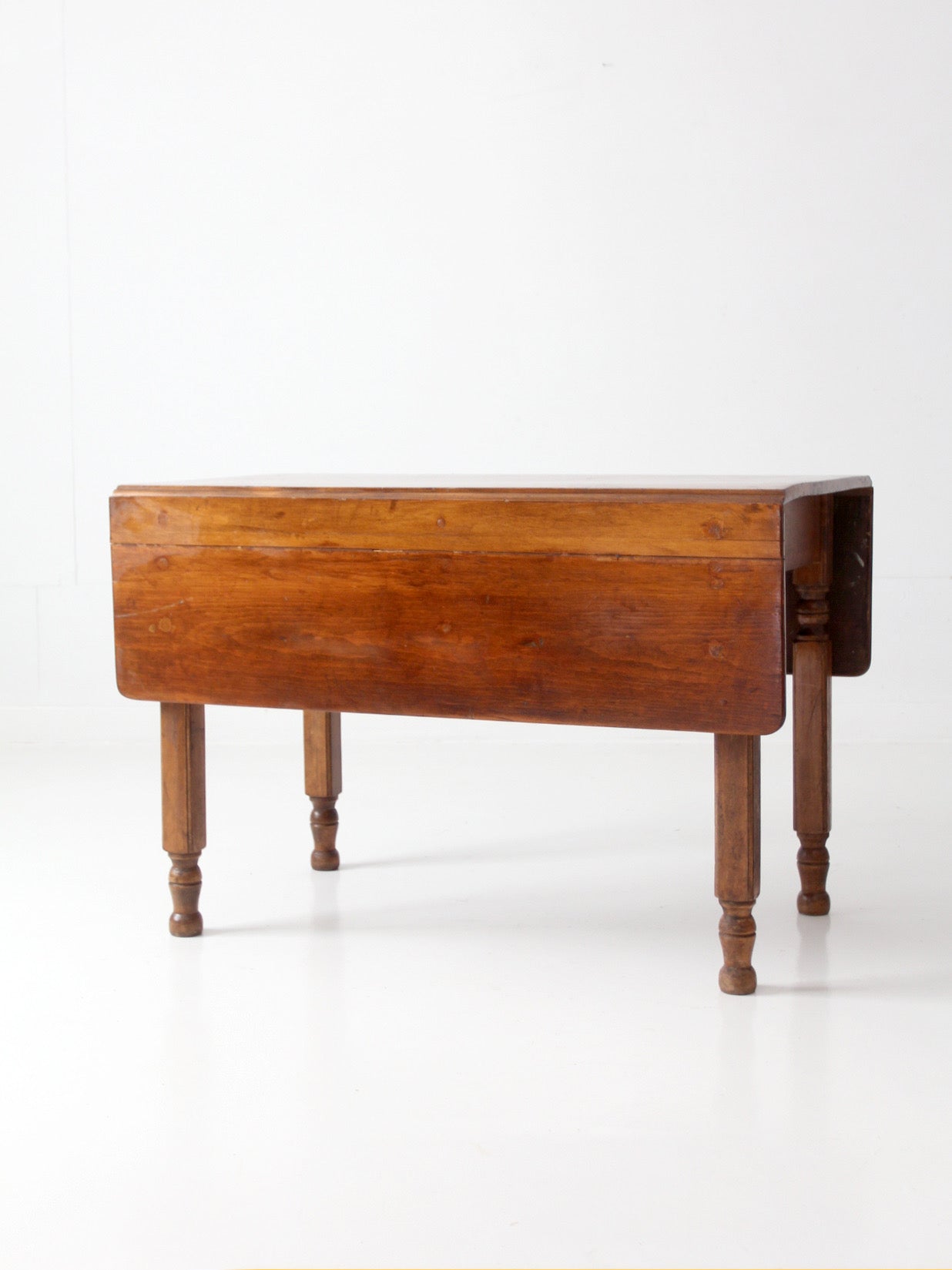 antique American country drop leaf table