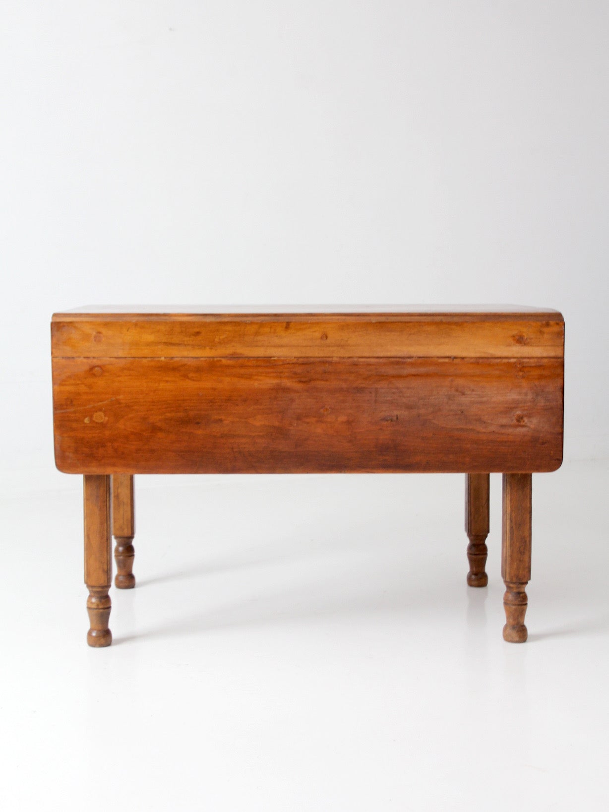 antique American country drop leaf table
