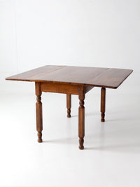 antique American country drop leaf table