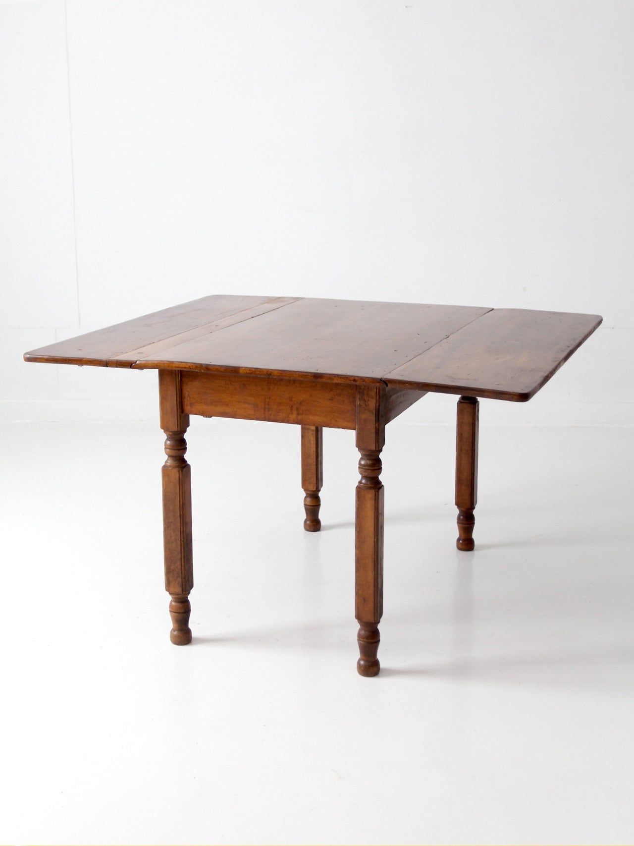 antique American country drop leaf table