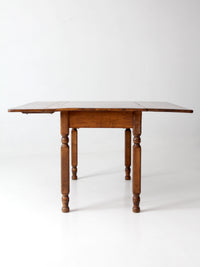 antique American country drop leaf table