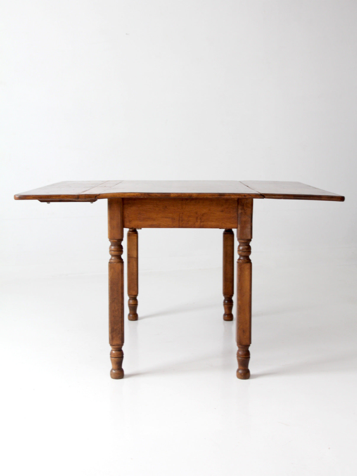 antique American country drop leaf table
