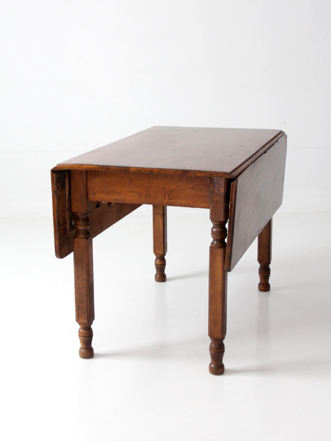 antique American country drop leaf table