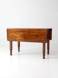 antique American country drop leaf table
