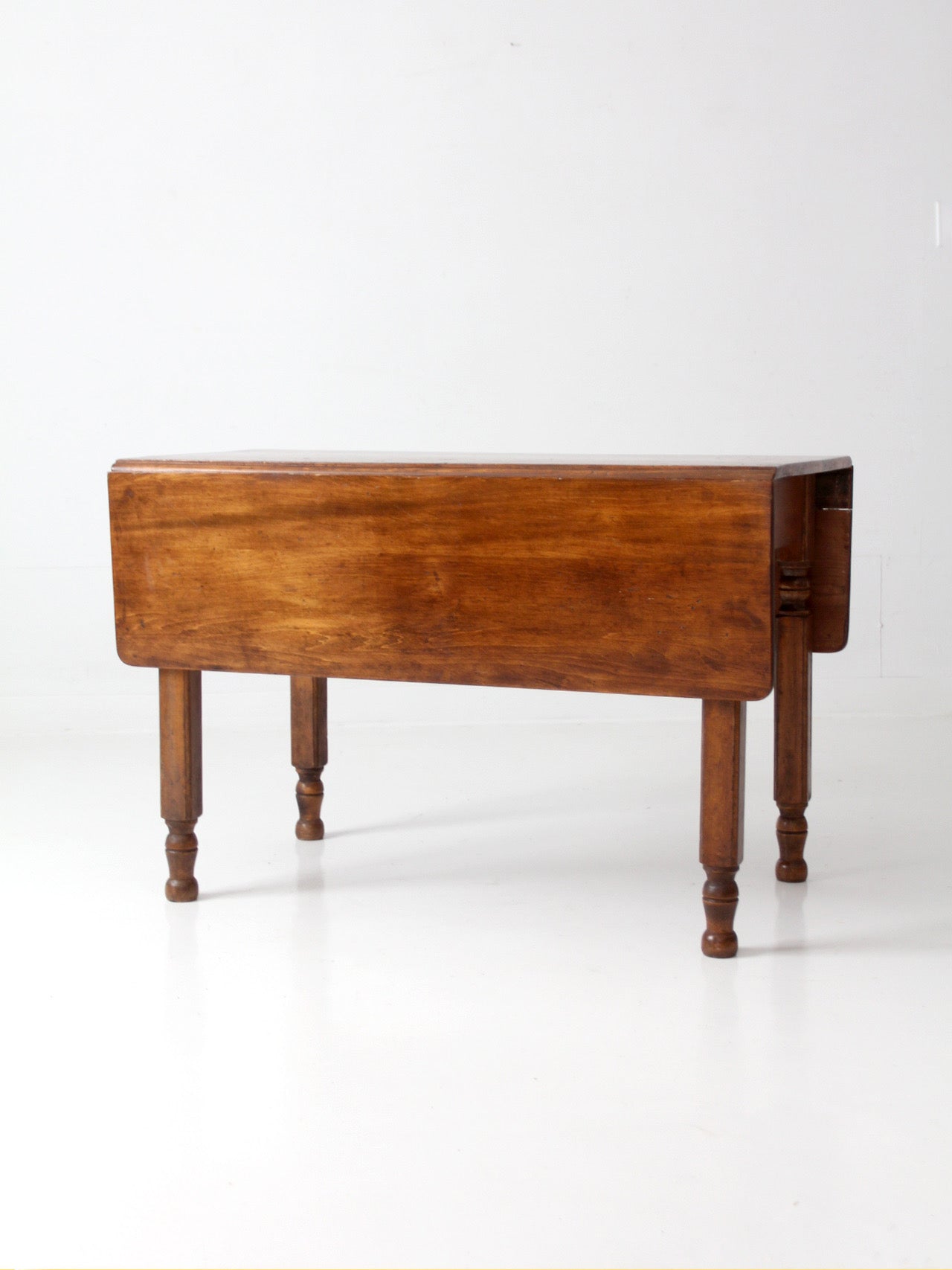antique American country drop leaf table