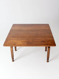 antique American country drop leaf table
