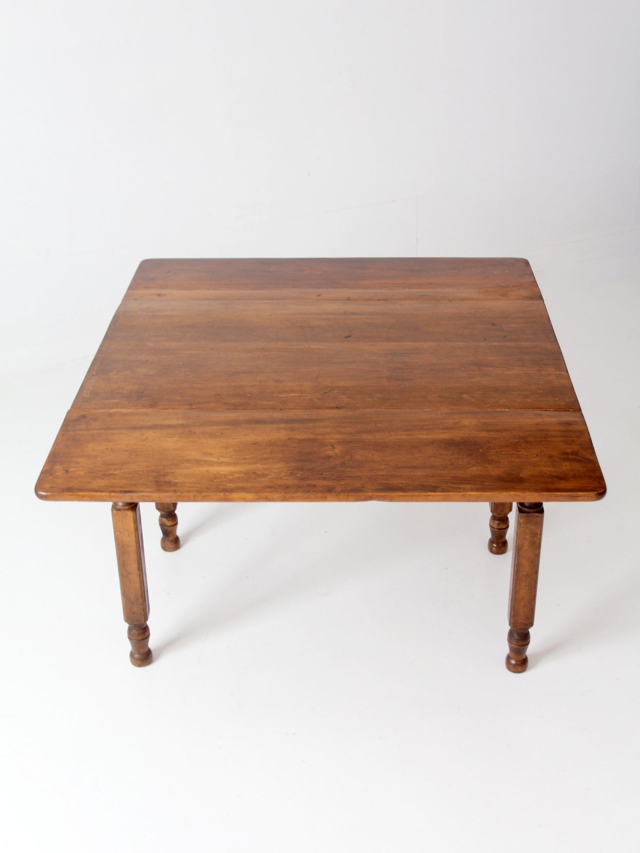 antique American country drop leaf table