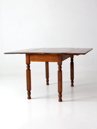 antique American country drop leaf table