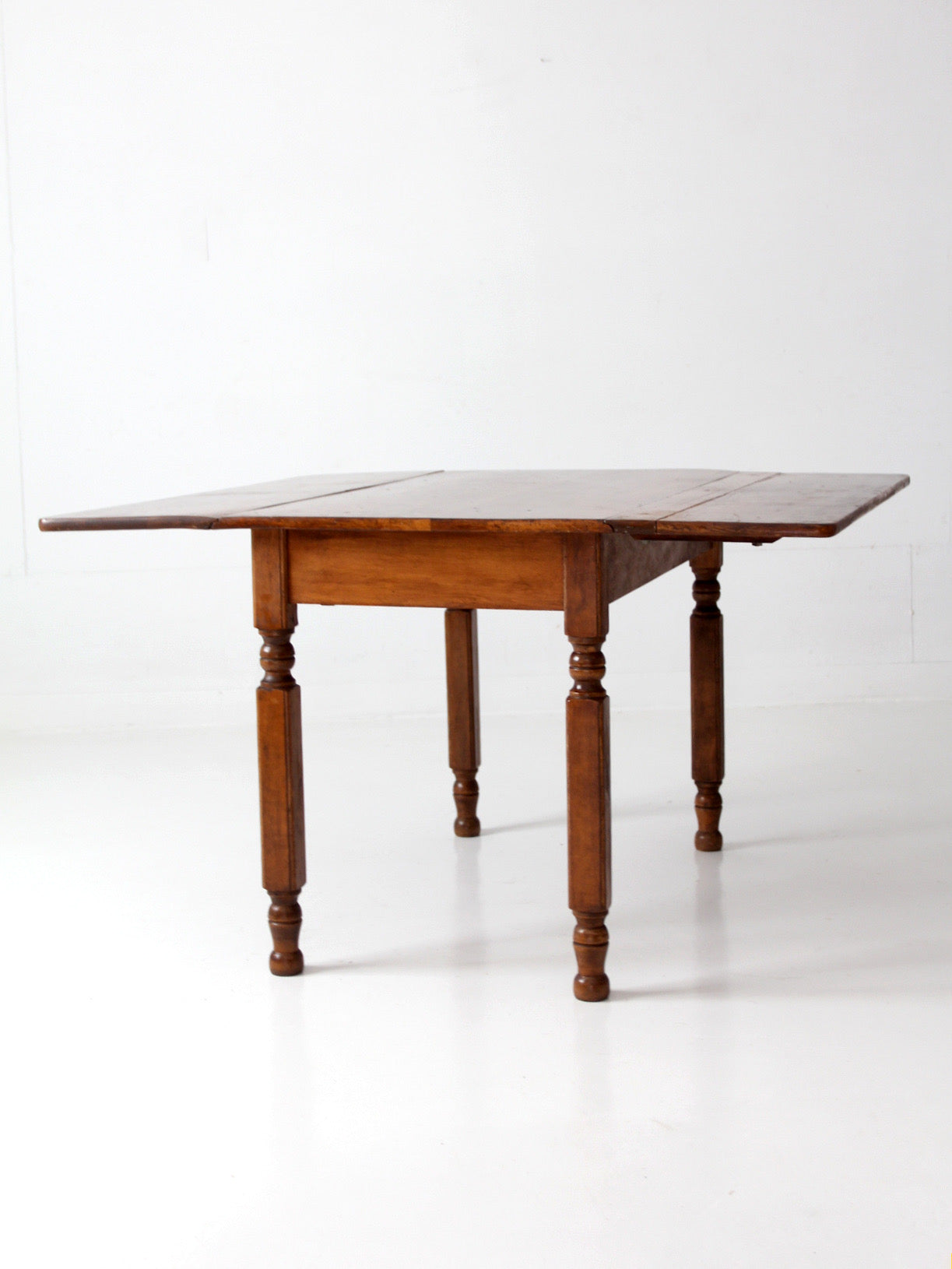 antique American country drop leaf table