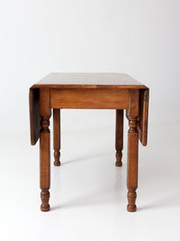 antique American country drop leaf table