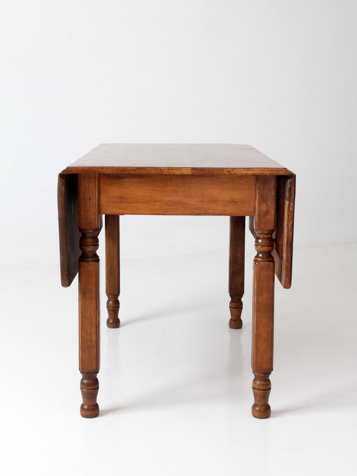 antique American country drop leaf table
