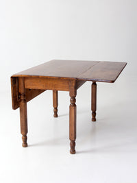 antique American country drop leaf table