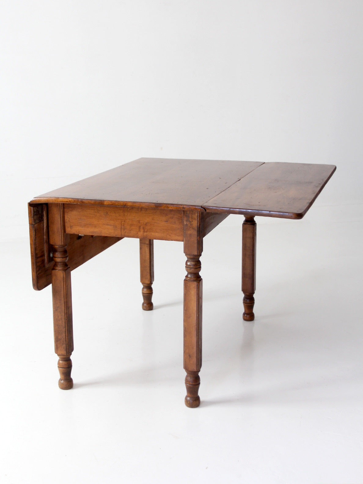 antique American country drop leaf table