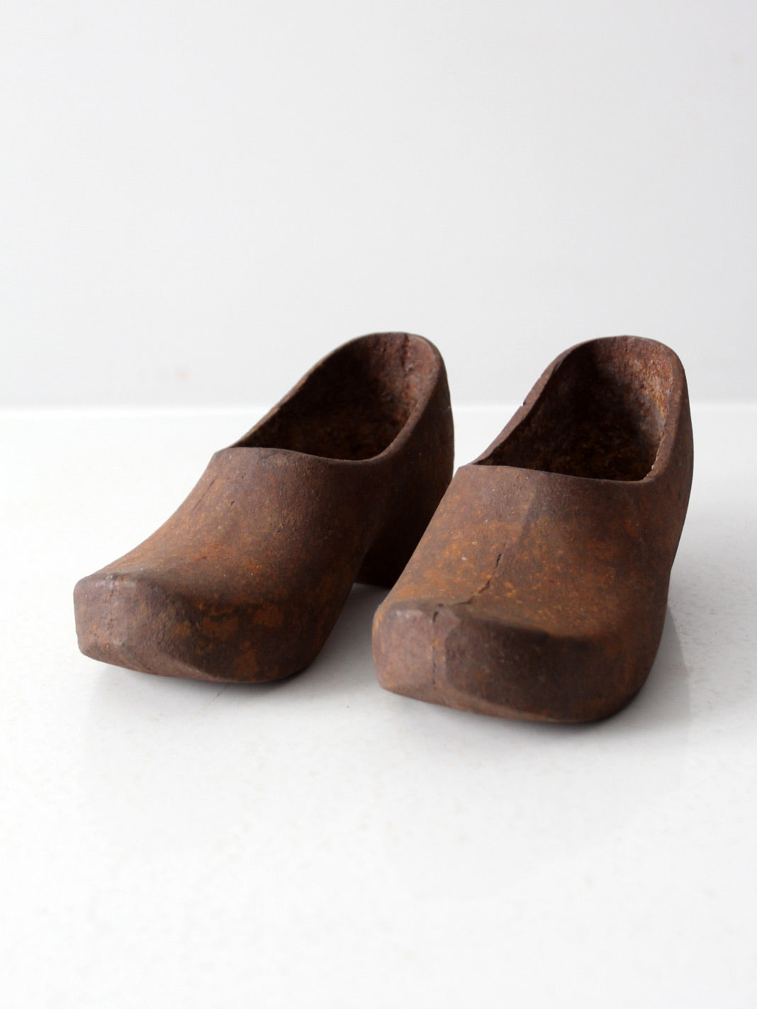 vintage cast iron decorative clogs